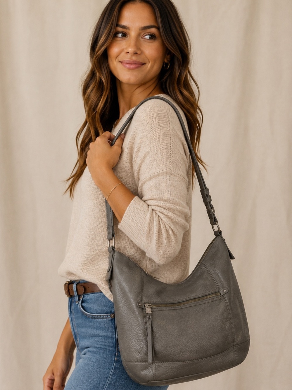 The Sak Sequoia Hobo Bag in a dark gray or "slate" color.